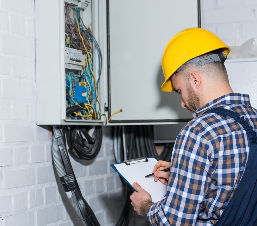 professional-electrician-inspecting-wires-in-electrical-box.jpg professional-electrician-inspecting-wires-in-electrical-box.jpg